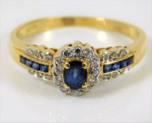 An 18ct gold diamond & sapphire ring 2.6g size M