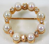 An 18ct gold brooch set with pearl & 0.5ct diamond