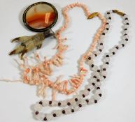 An agate brooch, a coral necklace, a grouse claw &
