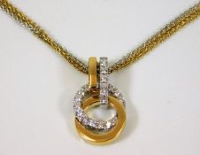 An 18ct two colour gold pendant & necklace set wit