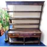 A 17thC. rustic oak dresser with three drawers H76