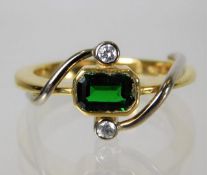 An 18ct gold ring set with green garnet and diamond 9.6g Size R