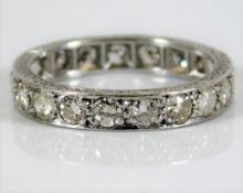 A platinum eternity ring with carved sides set approx 1ct diamonds 3.7g size K