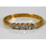 An 18ct gold ring set with five small old cut diam