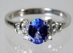 An 18ct white gold ring set with tanzanite and 0.2