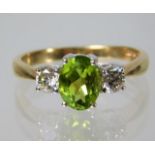 A 9ct gold ring set with peridot and 0.5ct diamond 2.8g Size P