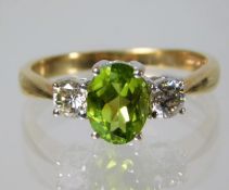 A 9ct gold ring set with peridot and 0.5ct diamond 2.8g Size P