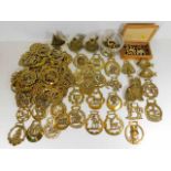 A quantity of approx. sixty five various horse brasses twinned with various other brass items