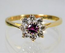 An 18ct gold ring set with diamond and ruby 3g Siz