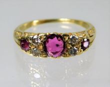An 18ct antique gold ring set with diamond and ru