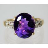A 9ct gold ring set with amethyst and diamond 2.5g