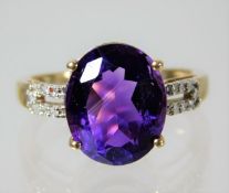 A 9ct gold ring set with amethyst and diamond 2.5g