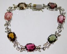 A 9ct white gold bracelet set with fancy tourmalin