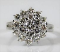 An 18ct white gold diamond cluster ring set with approx. 1.64ct diamond 5g size P/Q