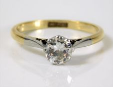 An 18ct gold diamond solitaire ring set with platinum mounted 0.75ct diamond of good colour & clarit