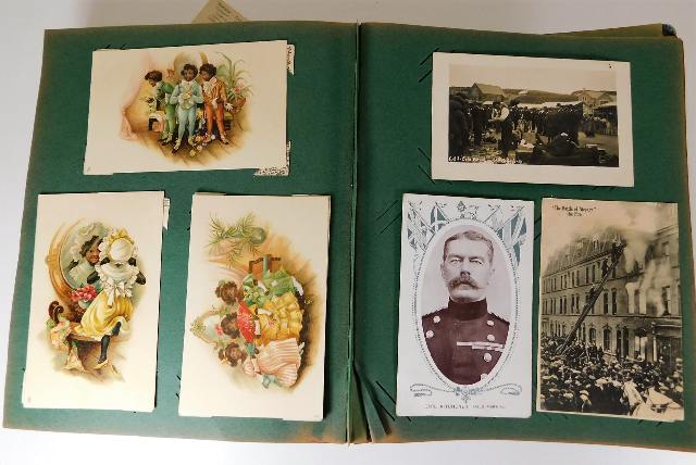 A postcard album and two Wills Cigarettes picture