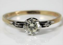 An art deco 18ct gold diamond solitaire ring with platinum mounted diamond of 0.75ct, 2.4g size S
