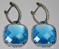 A pair of 14ct white gold earrings set with 'Londo