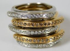 An 18ct two colour gold ring set with approx. 1ct