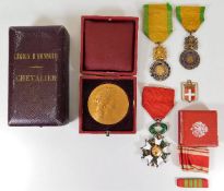 French Legion D'Honneur Chevalier and two Valeur et Discipline medals twinned with a gilt bronze med