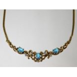 A 9ct gold necklace set with diamond and topaz 8.2