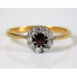An 18ct gold ring diamond & ruby ring set with 0.4