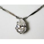 A platinum necklace set with a pear shaped diamond
