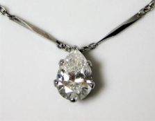 A platinum necklace set with a pear shaped diamond