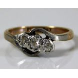 A 9ct gold ring set with with three platinum mount