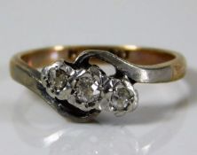 A 9ct gold ring set with with three platinum mount