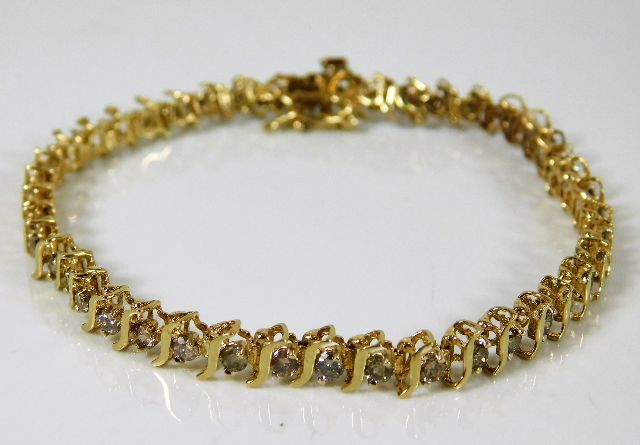 A 10ct gold line bracelet set with 2ct diamond 7.5