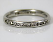 A platinum half eternity ring set with 14 diamonds