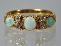 A 15ct gold antique ring set with diamond and opal 3.4g size L