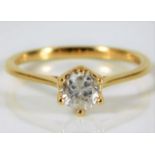An 18ct gold ring set with H colour 0.6ct diamond