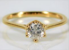 An 18ct gold ring set with H colour 0.6ct diamond