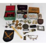 Collection of badges, a snuff bottle box cards, razor kit, cigarette holder & other sundry items