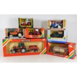 Seven boxed agricultural vehicles including Corgi & Britains