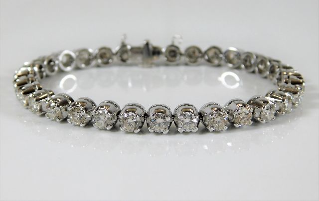 A platinum line bracelet set with approx. 7.75ct d