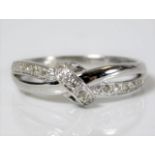 A 9ct white gold ring set with fifteen diamonds 2g