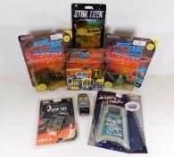 A collection of Star Trek toys including a car air freshener