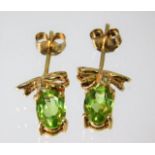 A pair of 9ct gold peridot and diamond earrings 1.9