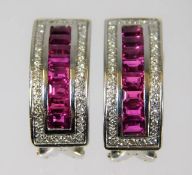 A pair of 18ct white gold earrings set with approx