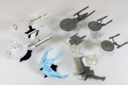 Three Ertl miniature metal space ship models with five others all with stands