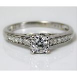 A 9ct white gold ring set with diamond, centre sto