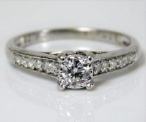 A 9ct white gold ring set with diamond, centre sto