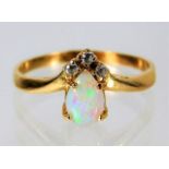 Yellow metal ring tests as 14ct set with diamond and opal 2g size N