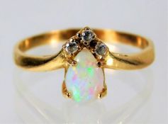 Yellow metal ring tests as 14ct set with diamond and opal 2g size N