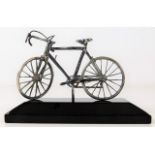 Silver hallmarked bicycle mounted on plinth