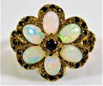 A 9ct gold ring set with sapphire and opals 4.6g size N