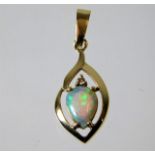 A 14ct gold pendant set with diamond and opal 1.4g